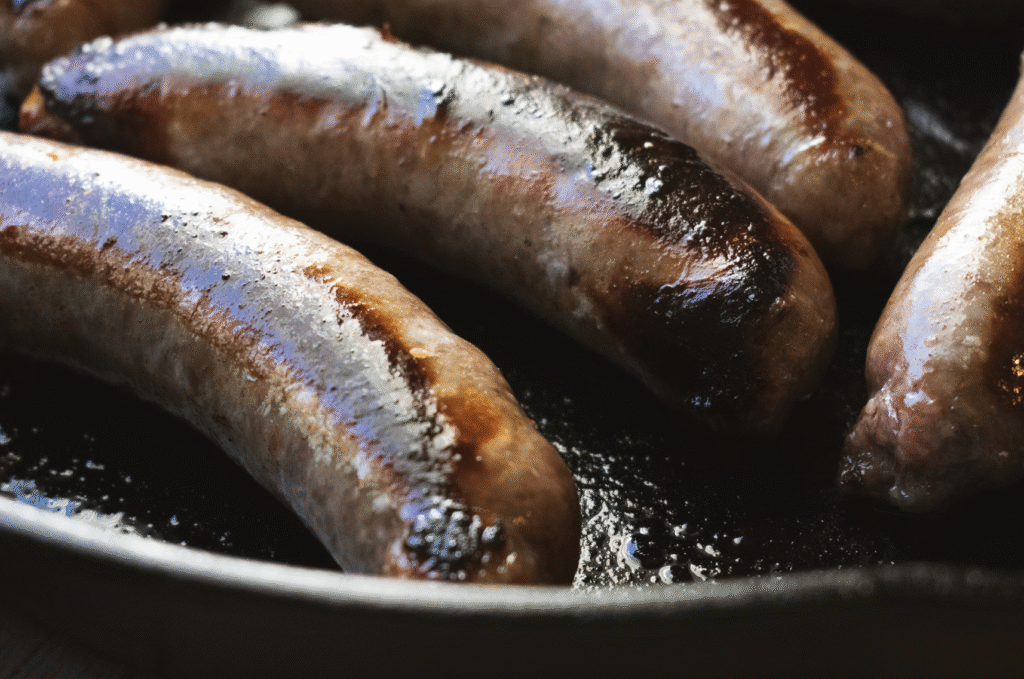 Beef and Guinness Sausages cooking in pan