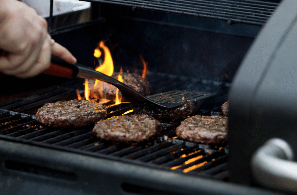 man barbecue burgers