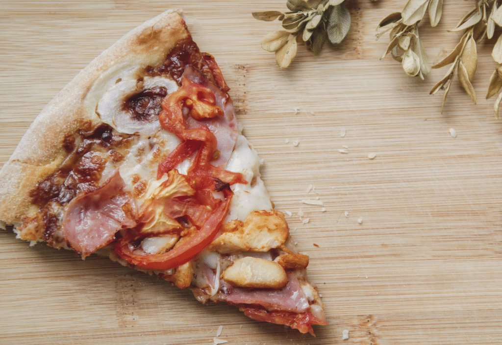 slice of ham and vegetable pizza