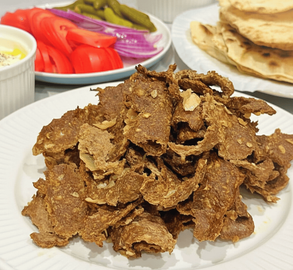 lamb doner meat shredded on a plate