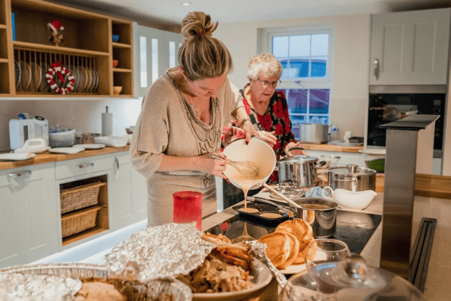 mum and grandmother cooking on christmas in the kitchen